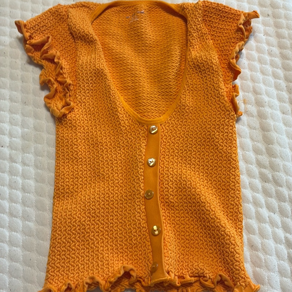 Out from under orange top